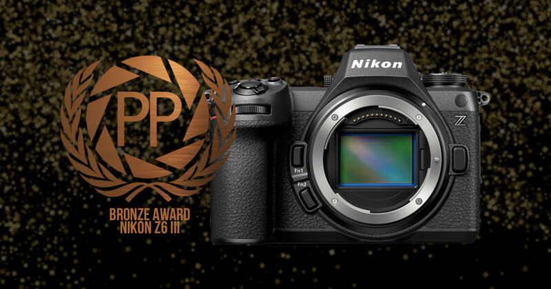 A Nikon Z6 camera is displayed against a glittering background. To its left, a bronze award emblem features the text "PP Bronze Award Nikon Z6III".