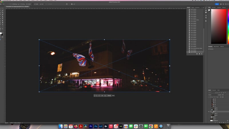 A screenshot of Adobe Photoshop shows a nighttime city photo being edited. The image features a building with bright pink lights, Union Jack flags, and streetlights. Photoshop toolbars and menus are visible on the screen.