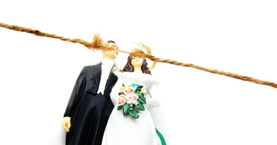 Fraying rope above bride and groom